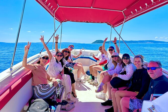 Blue Lagoon Tour from Split with Bottled Water and Wine Included - Čiovo Island beach break: pine trees, quick relaxation, then back on the boat