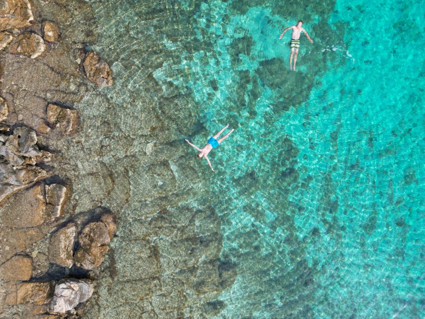 From Makarska: Hidden Gems of Hvar Island's North Shore - Veliki Pokrivenik Bay: Cliffs, Pebbles, and a Hidden Cave Feel