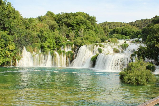 Krka National Park & Primošten Tour from Split or Trogir - Krka National Park entry, wooden paths, and the Skradinski Buk payoff