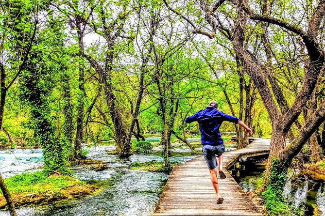 Krka waterfalls tour from Split - blue & green oasis - Entering Krka National Park: Wooden Pathways and Big Water Moments