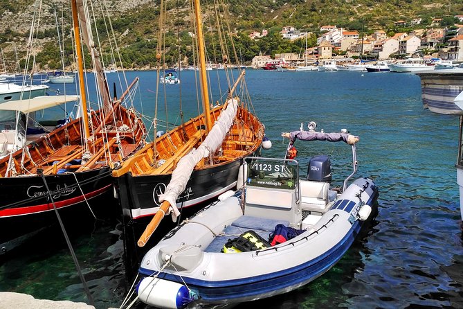 Private boat tour to Blue Lagoon & 4 Islands - Trogir from the water: cliffs, crystal sea, and a bridge pass