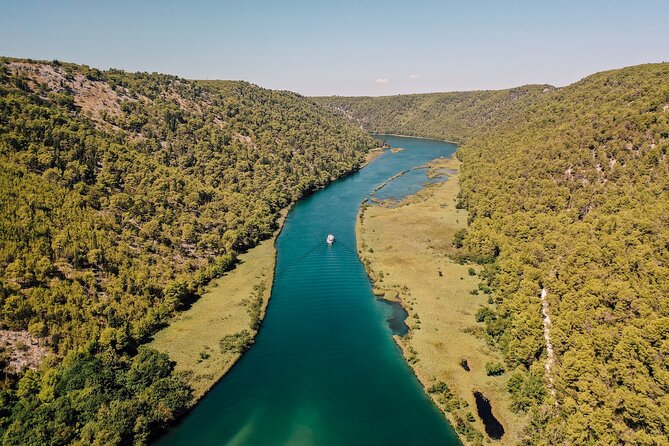 Private Full-Day Krka Waterfalls Tour with Wine Tasting - Sladić Winery wine tasting in a Dalmatian village setting