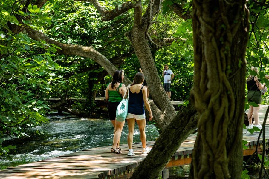 Split: Krka National Park Day Trip with Boat Ride & Swimming - Krka National Park trails: waterfalls, Ethno village details, and easy self-guided time
