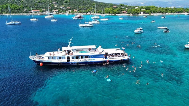 Split: Trogir Walking Tour, Blue Lagoon & Shipwreck Cruise - Onboard vibe and comfort: open decks, air conditioning, and an aqua slide