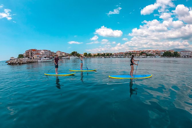 Stand Up Paddle adventure in Split - Stobreč White Rocks and Cliffs: Jumping, Snorkeling, and Periska Shells