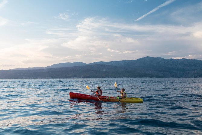 Sunset Kayaking - The westward paddle: pine, olive, and that dry-stone look