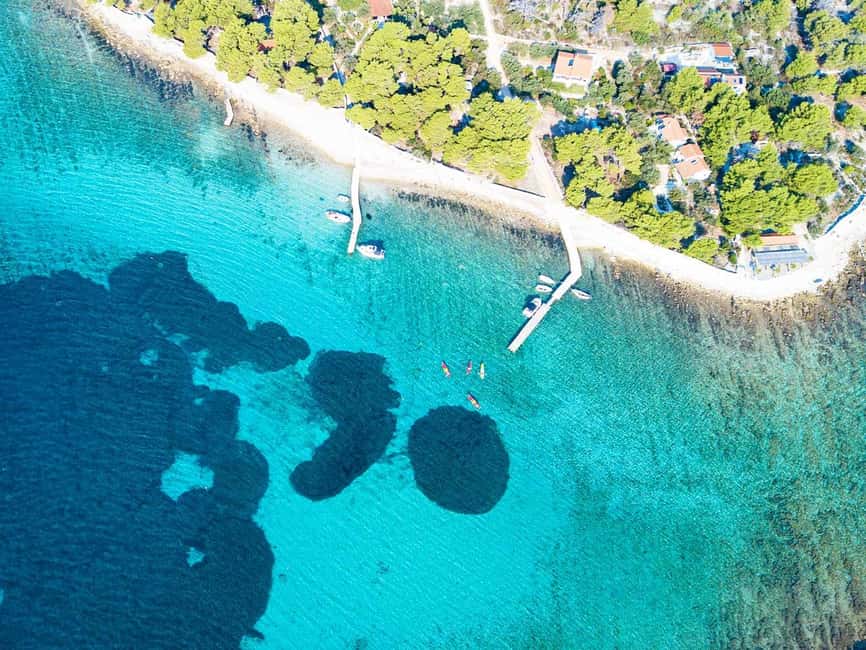 Trogir: Blue Lagoon, Maslinica, and Solinska Bay Boat Tour - Maslinica Village Time and That Castle View